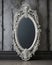 vintage ivory empty mirror frame, with a skull design at the top ai created