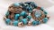 Vintage jewelry: beads, turquoise necklace, brooches with turquoise crystals.