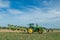 Vintage John Deere tractor pulling a plough