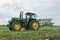 Vintage John Deere tractor pulling a plough