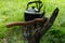 Vintage kettle for heating water and an ax, against the backdrop of nature. Men\'s style