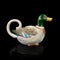 Vintage kettle shaped duck. retro teapot in the shape of a bird.