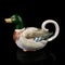 Vintage kettle shaped duck. retro teapot in the shape of a bird.