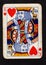 A vintage king of hearts playing card on a black background.