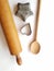 Vintage kitchen tools, heirloom rolling pin, wooden spoon, cookie cutters, copy space below and right