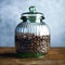 Vintage large glass vase filled with coffee beans on wood table