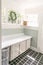 A vintage laundry room filled with windows and natural light