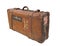 Vintage leather suitcase with straps isolated.