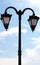 Vintage lighting with twin double lamp lantern background of sky