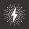 Vintage lightning bolt and sun rays on grunge background. Lightnings with sunburst effect. Thunderbolt, electric shock