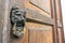 Vintage Lion Head Door Knocker on Wood Door in Antigua, Guatemala