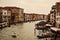 Vintage look of Canal Grande in Venice with boats on the water and classic houses on the sides