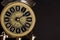 Vintage Look Clock close up on black background