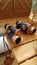 Vintage looking copper finish binoculars on a wooden table.