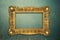 Vintage luxury golden frame with ornate baroque decoration on rustic textured wall background