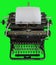Vintage manual typewriter isolated on green background