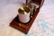 Vintage marine barograph with opened cover standing on a navigational chart
