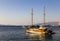 Vintage mast wooden sailing ship for sea tours in port of Saranda, Albania on sunset or sunrise. Sea landscape. Copy space for