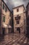 Vintage medieval square with ancient stone pavers with medieval architecture in old european city Kotor in Montenegro