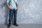 Vintage men clothings retro style with low key lighting over loft concrete wall background.