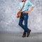 Vintage men clothings retro style with low key lighting over loft concrete wall background.