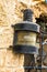 Vintage metal marine lantern attached to the wall