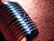 Vintage metal microphone against red curtain on empty theatre stage. 3d render