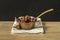 Vintage metal saucepan full of roasted chestnuts typical of Spanish autumn