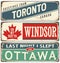 Vintage metal signs collection with Canada cities.