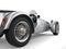 Vintage metallic silver open wheel sport racing car - rear wheel closeup shot