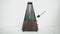 Vintage metronome, on a white background.