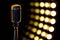 Vintage microphone with color background in nightclub