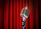 Vintage Microphone over Red Curtains