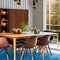 A vintage, mid-century modern dining room with iconic Eames chairs, a teak dining table, and vintage light fixtures2, Generative
