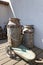 Vintage milk churns with cart