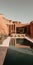 Vintage Minimalism: A Desert Home With A Pool And High Rocks