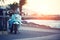 Vintage motor scooter Vespa, traditional bike in the pictursque pier of Buyukada, Istanbul at sunset