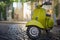 Vintage motorbike parked on cobblestone street