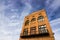 Vintage Multi Story Brick Building With Boarded Up Windows