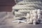 Vintage nautical still life with rope, starfish and coral on old wooden background