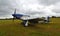 Vintage North American P-51D Mustang Aircraft `Miss Helen` on airstrip.