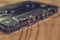 vintage old film music cassette on a wooden background, music background, music lovers, close up