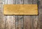 Vintage old grungy paper banner over ancient wood background