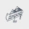 Vintage old logo or badge, label engraved and old hand drawn style with lettering camping and mountains
