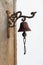 Vintage old metal bell hang on stone arch