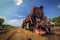 Vintage old rusty steam train under blue sky