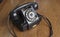 Vintage old telephone on wooden desk. technology of yesteryear