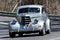 Vintage Oldsmobile driving on country road