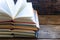 Vintage opened books on a wooden background