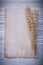 Vintage paper wheat rye ears on wooden board